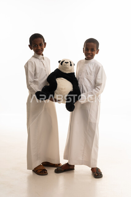 Saudi Boys Holding Panda Plush Toy in Studio