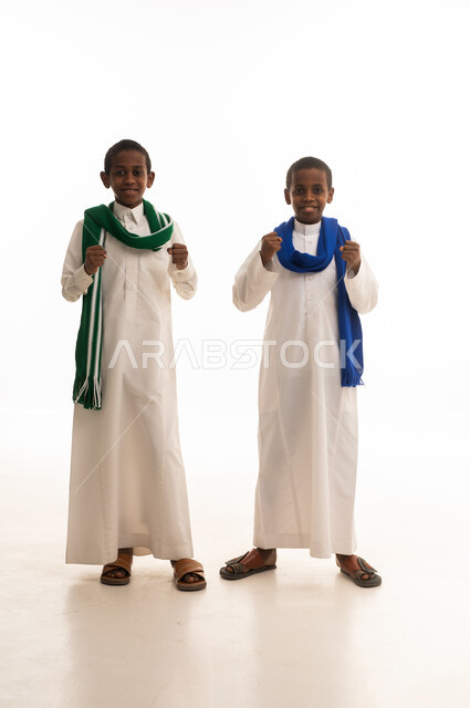Saudi Boys in Traditional Thobes Celebrating in Studio