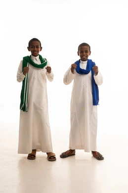 Saudi Boys in Traditional Thobes Celebrating in Studio
