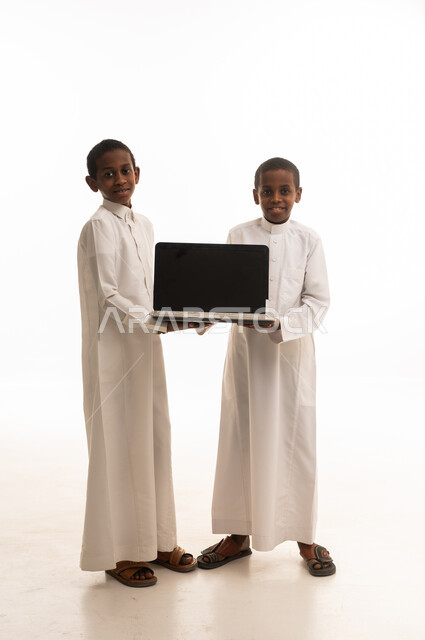 Saudi Boys Holding Laptop on White Background