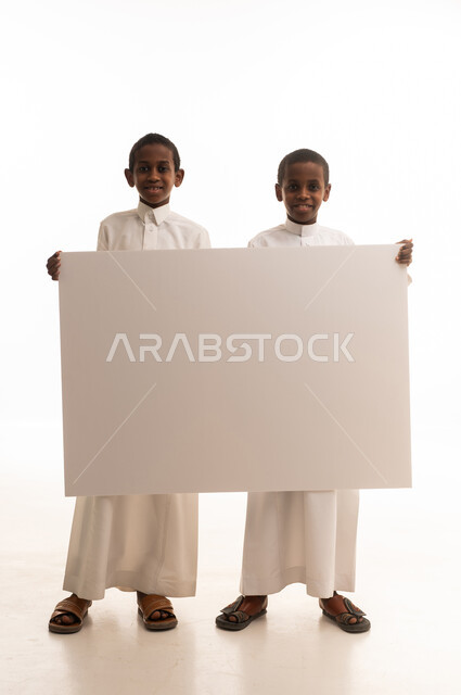 Saudi Boys Holding Blank White Signage Board