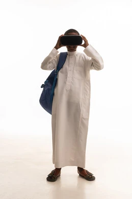Saudi Boy Using VR Headset on White Background