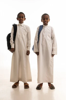 Saudi Boys in White Thobes with School Backpacks