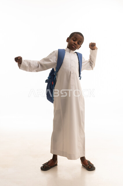 Saudi Boy Student with Backpack in White Thobe