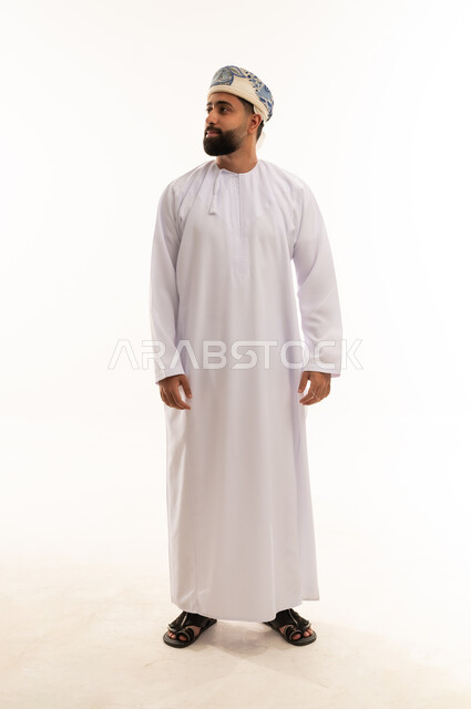 Omani Man in Traditional Dishdasha and Kumma Cap