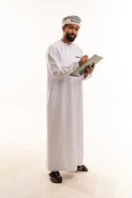 Omani Man in Traditional Attire Holding a Clipboard