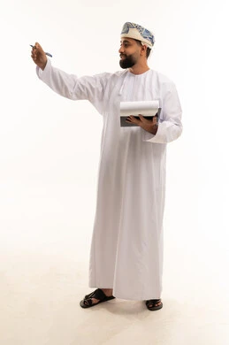Omani Man in Traditional Dress Writing in Studio