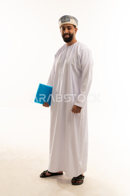 Omani Man in Traditional Dress Holding Blue Folder