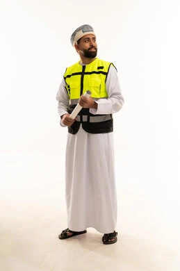 Omani Engineer Holding Blueprint in Safety Vest