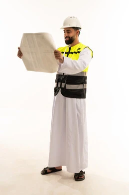 Arab Engineer Reading Construction Blueprint in Studio