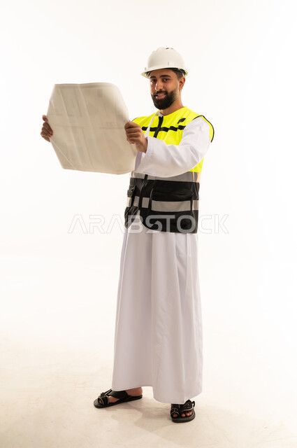 Arab Engineer in Thobe Holding Blueprint on White Background