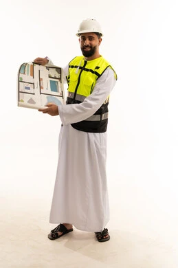 Arab Engineer Holding Floor Plan in Safety Gear