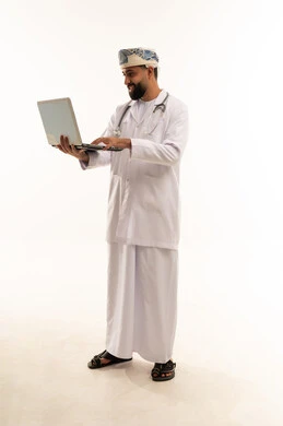 Omani Doctor Using Laptop on White Background