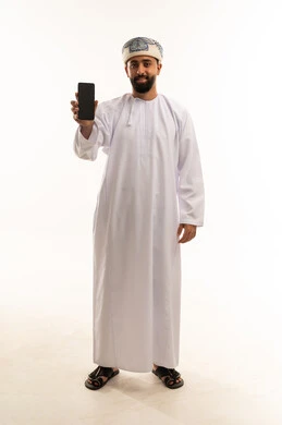 Omani Man in Traditional Dress Holding Smartphone