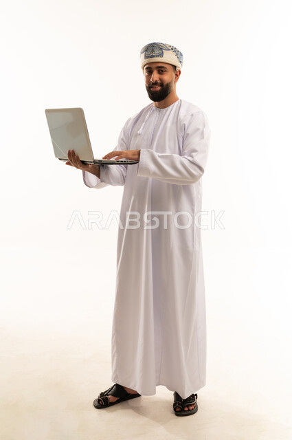 Omani Man Using Laptop on White Background