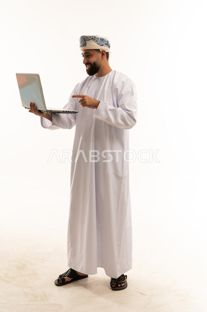 Omani Man Using Laptop on White Background