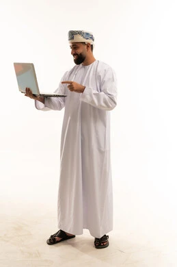 Omani Man Using Laptop on White Background