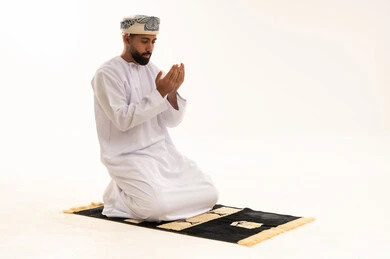 Omani Man Praying and Supplicating on White Background