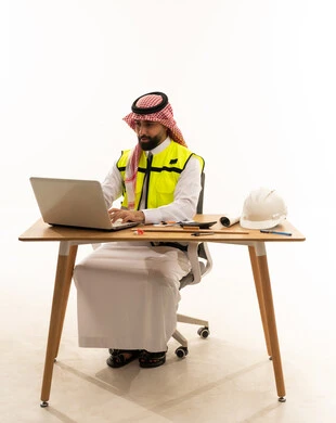 Saudi Male Engineer Working on Laptop at Desk