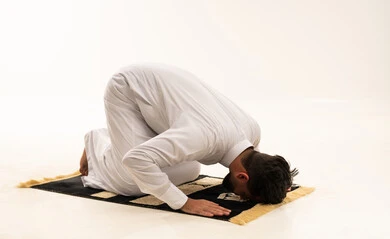 Saudi Man Performing Sujud Prostration in Studio