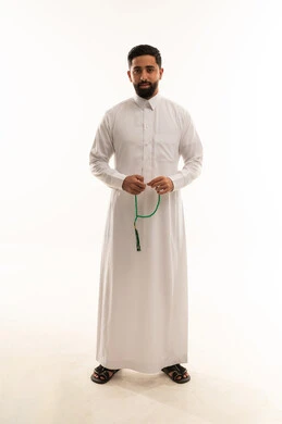 Saudi Man in White Thobe Holding Prayer Beads