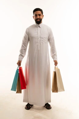 Saudi Man Holding Colorful Shopping Bags in Studio
