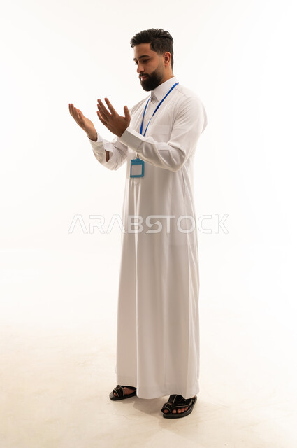 Saudi Man in White Thobe Performing Prayer Supplication