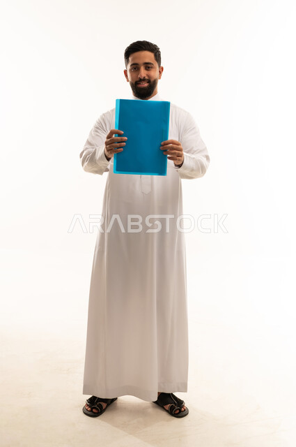 Saudi Man in Traditional Thobe Holding Blue Folder