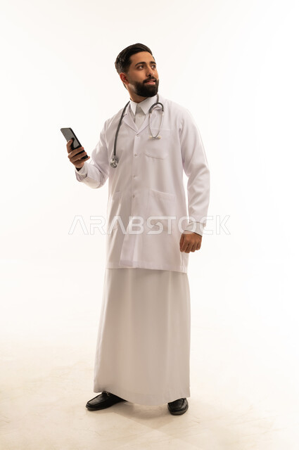 Saudi Male Physician in Lab Coat Holding Smartphone