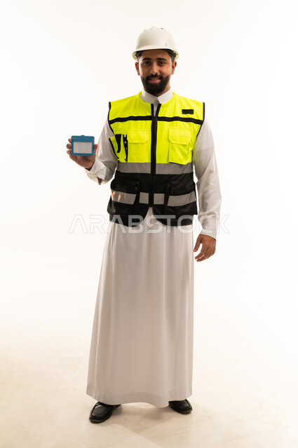 Saudi Engineer Holding ID Card in Safety Gear