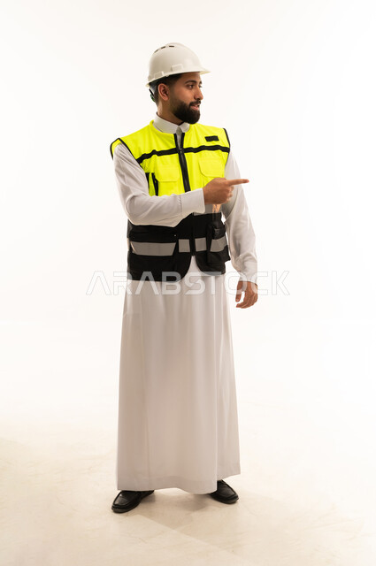 Saudi Engineer in Safety Vest Pointing in Studio