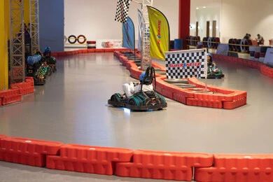 Saudi Man Driving Go-Kart on Indoor Racing Track