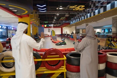 Emirati Couple at Indoor Go-Karting Racing Track
