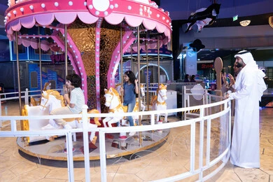 Emirati Father and Children at Indoor Amusement Park