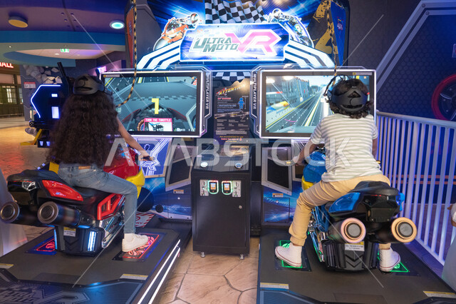 Children Playing Virtual Reality Motorcycle Racing Game