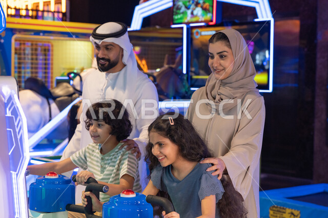 Saudi Family Playing Games in Indoor Amusement Center