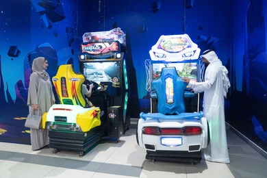 Emirati Family at Indoor Arcade Gaming Center