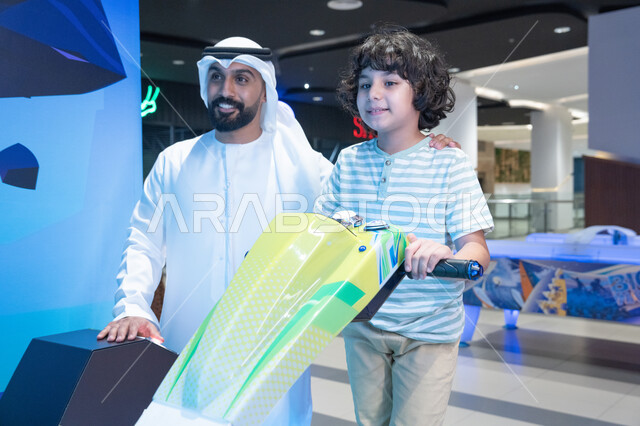 Emirati Man and Boy at Gaming Simulator Center