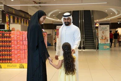 Emirati Family Shopping in Modern Supermarket