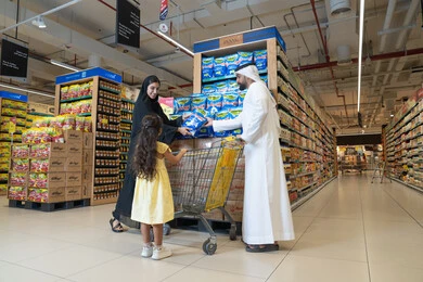 Emirati Family Shopping in Modern Supermarket Aisle