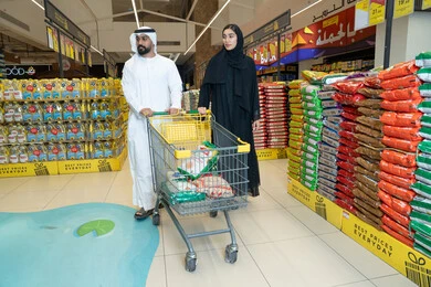 Emirati Arab Couple Shopping with Cart in UAE Supermarket