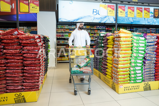 Emirati Man Shopping at Supermarket with Cart