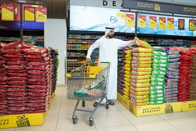 Emirati Man Shopping in Supermarket with Cart
