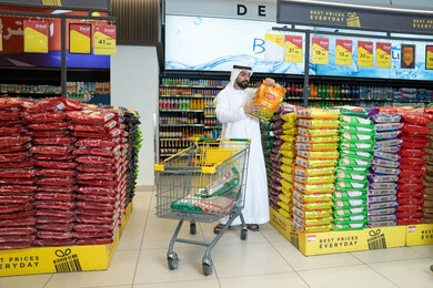 Emirati Man Shopping at Modern UAE Hypermarket