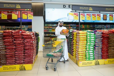 Emirati Man Shopping in Supermarket with Cart