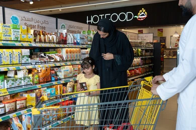Emirati Family Shopping in Modern Supermarket Aisle