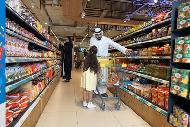 Emirati Family Shopping in Supermarket Aisle