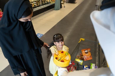 Emirati Mother and Daughter Shopping at Supermarket