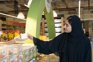 Emirati Woman Shopping in Modern Supermarket Interior