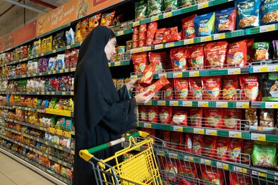 Emirati Woman Shopping in Supermarket Aisle
